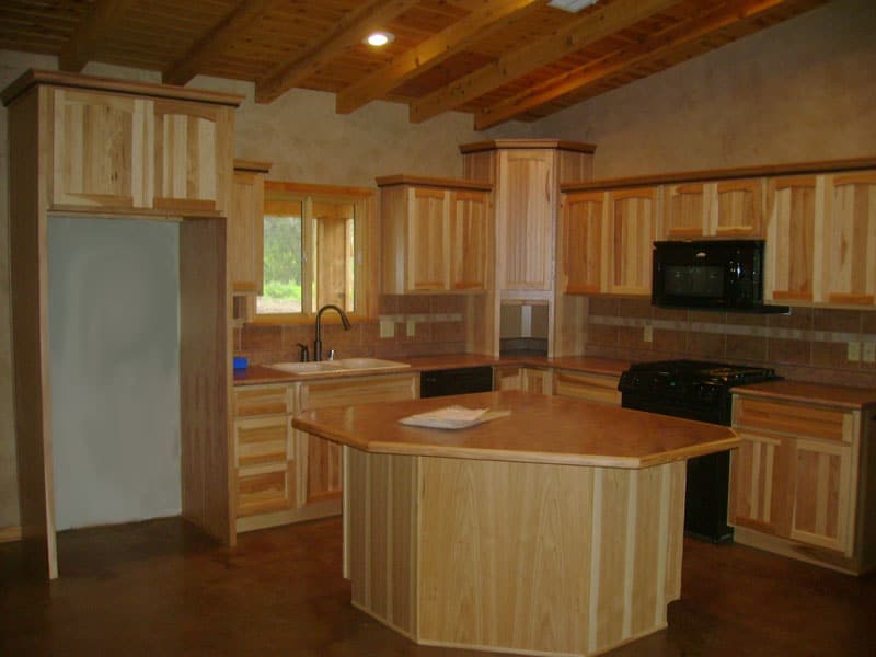 Kitchen ceiling in a log home by Dillwood LLC