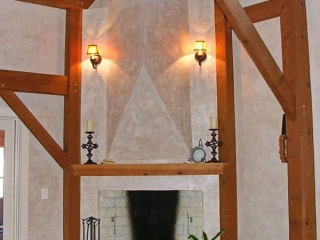 timber frame fireplace with Venetian plaster